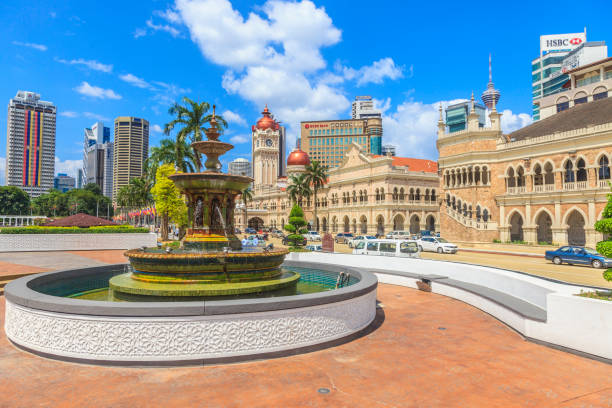 Photo of the fountain in Merdeka Square in Kuala Lumpur overlooking the Sultan Abdul Samad Building during the day in a blue sky photographed in Malaysia in November 2013